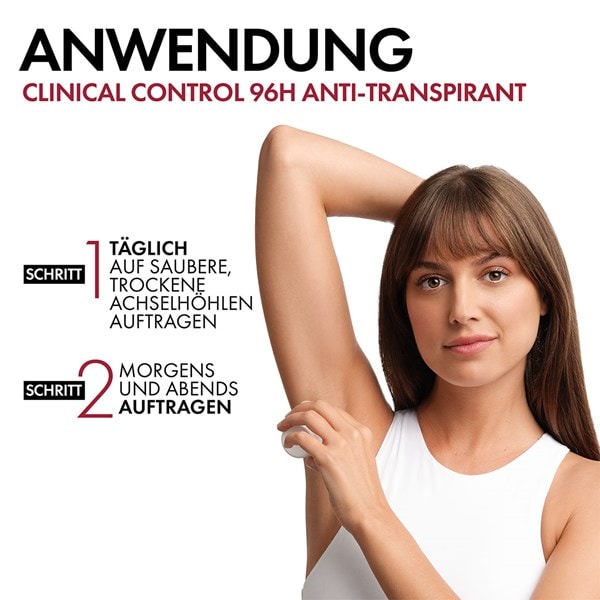 Junge Frau mit weissem Oberteil und glatten Achseln zeigt Anwendung des VICHY Clinical Control 96h Roll-on Deos für Frauen.