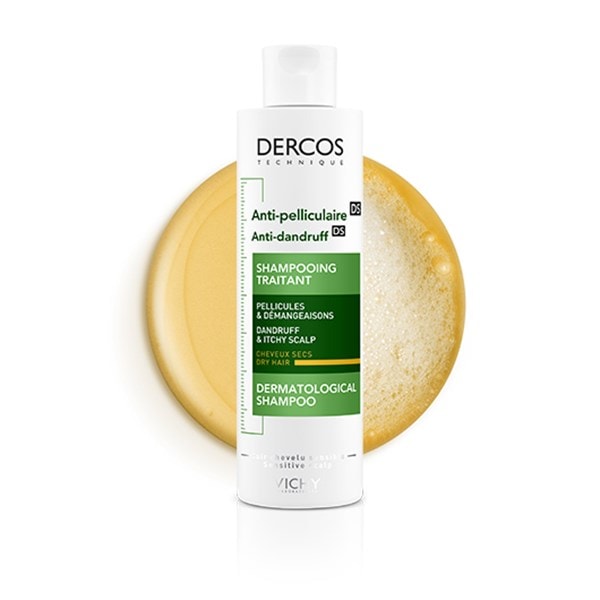 Produktbild des DERCOS Anti Schuppen Shampoos für trockenes Haar mit Textur im Hintergrund