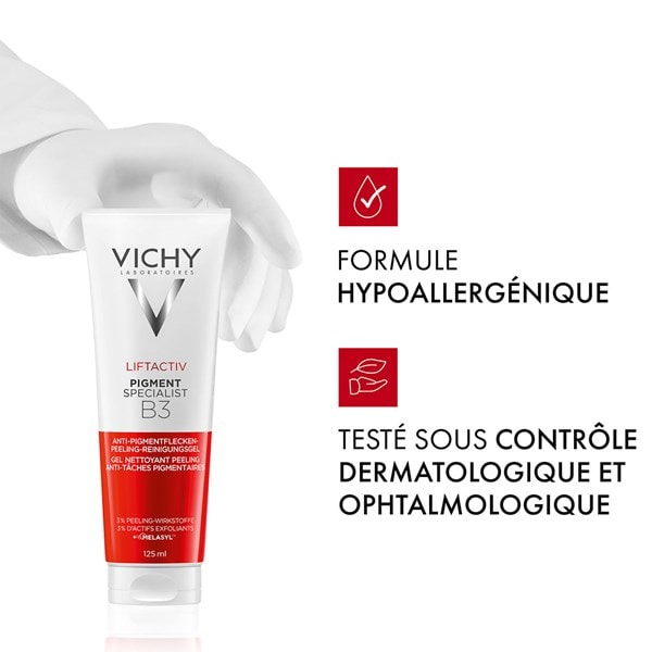 Main en gant blanc tenant un tube Vichy Liftactiv Pigment Specialist B3, avec icônes et texte « Formule hypoallergénique » et « Testé sous contrôle dermatologique et ophtalmologique »