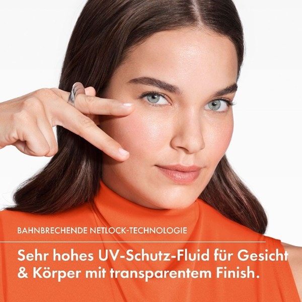 Person zeigt auf das Gesicht, Claim „Netlock-Technologie“ sowie Hinweis auf sehr hohen UV‑Schutz mit transparentem Finish für Gesicht und Körper.